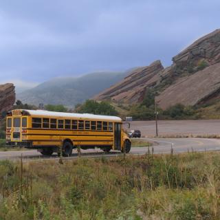 picture of Denver Public Schools bus travelling on a mountainous road